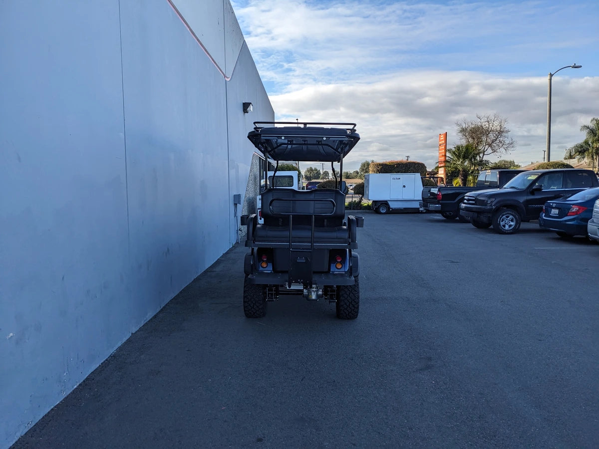 Rear view of a golf cart equipped with the EVO-CLASSIC2-6PASS-84RR3 EVOLUTION CLASSIC 6 PASSENGER ROOF RACK, showcasing custom fabrication designed for golf carts.