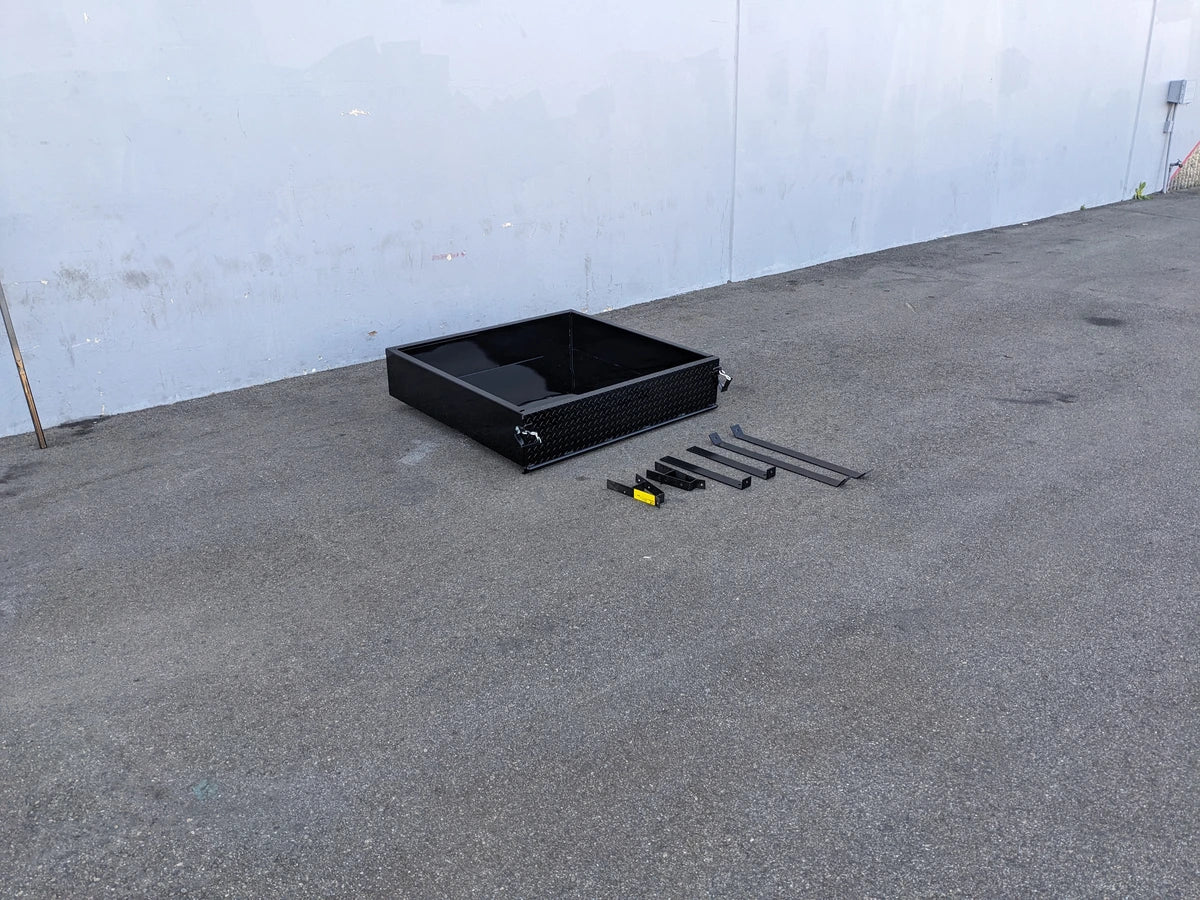 Black CC-PREC-UTIL42 CLUB CAR PRECEDENT EXTENDED UTILITY BOX WITH TAILGATE and custom fabrication parts for golf carts displayed on concrete floor near white wall.