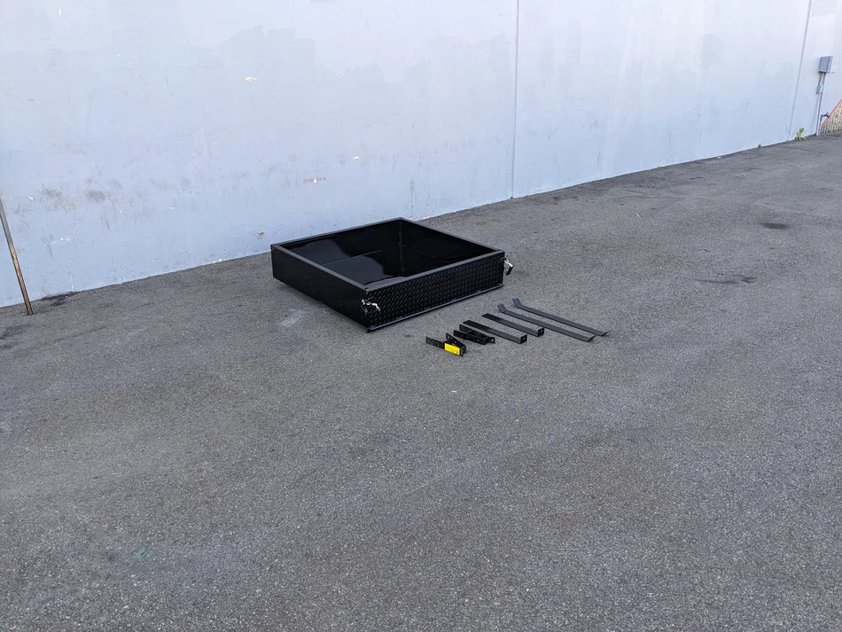 Black CC-PREC-UTIL42 CLUB CAR PRECEDENT EXTENDED UTILITY BOX WITH TAILGATE and custom fabrication parts for golf carts displayed on concrete floor near white wall.