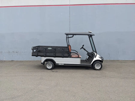 Golf cart featuring custom flatbed with STAKE-SIDES-44X72X18-COMP Flatbed Golf Cart Composite Stake Sides, designed for cargo and utility use with composite materials.