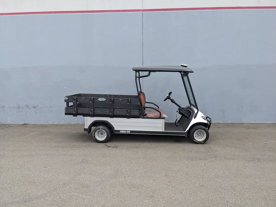 Golf cart featuring custom flatbed with STAKE-SIDES-44X72X18-COMP Flatbed Golf Cart Composite Stake Sides, designed for cargo and utility use with composite materials.