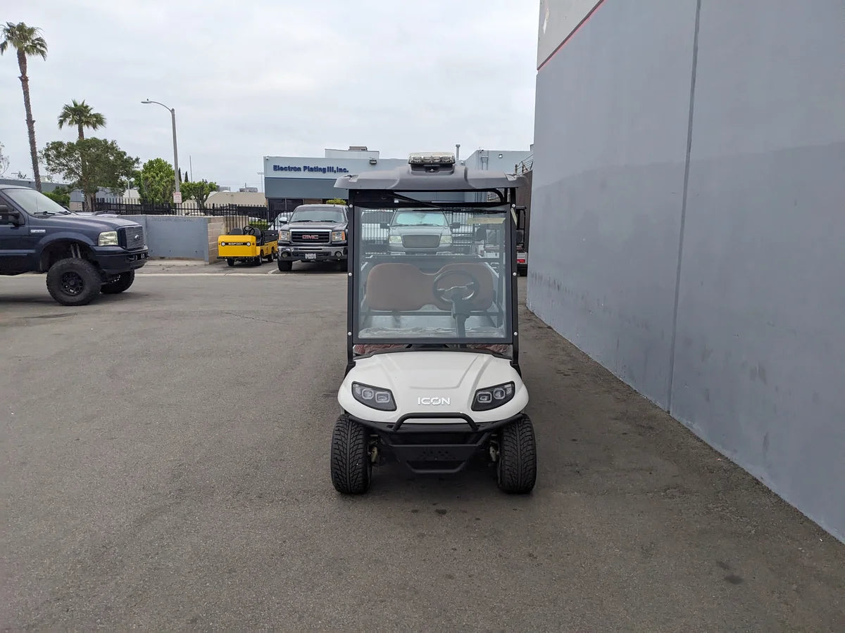 Front view of a golf cart with custom fabrication featuring STAKE-SIDES-44X72X18-COMP Flatbed Golf Cart Composite Stake Sides for enhanced cargo utility and specialty golf cart beds.