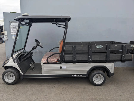 INVERTER-ICONC20U2013+-5000W Inverter Installation to Supply 15Amp 120VAC Outlet with Switch mounted on a utility golf cart featuring a flatbed cargo area, custom fabrication for golf carts.