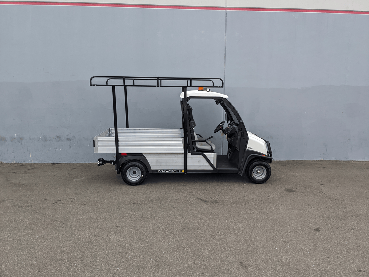 White utility golf cart equipped with a black steel ladder rack and cab guard, featuring the CC-710-50X96-CHASSIS-TLRA-GUARD CLUB CAR 710 TOP LADDER RACK AND CAB GUARD for cargo and utility transport.