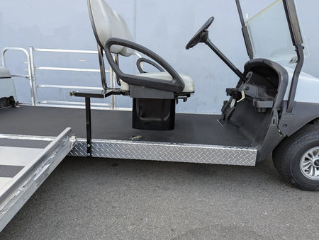 SEAT-POD-CC Heavy-Duty Club Car Seat Pod installed on a golf cart, featuring custom fabrication with diamond plate metal and a reinforced seating area for durability and utility.