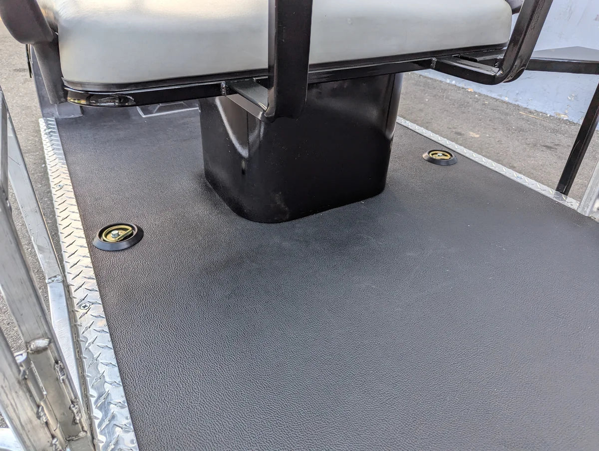 Close-up view of custom fabricated SEAT-POD-CC Heavy-Duty Club Car Seat Pod mounted on a golf cart deck with durable textured surface and integrated cargo tie-downs.