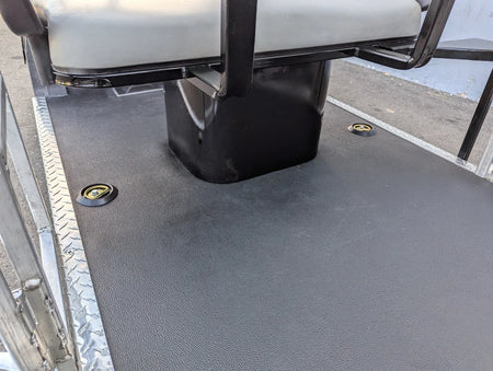 Close-up view of custom fabricated SEAT-POD-CC Heavy-Duty Club Car Seat Pod mounted on a golf cart deck with durable textured surface and integrated cargo tie-downs.