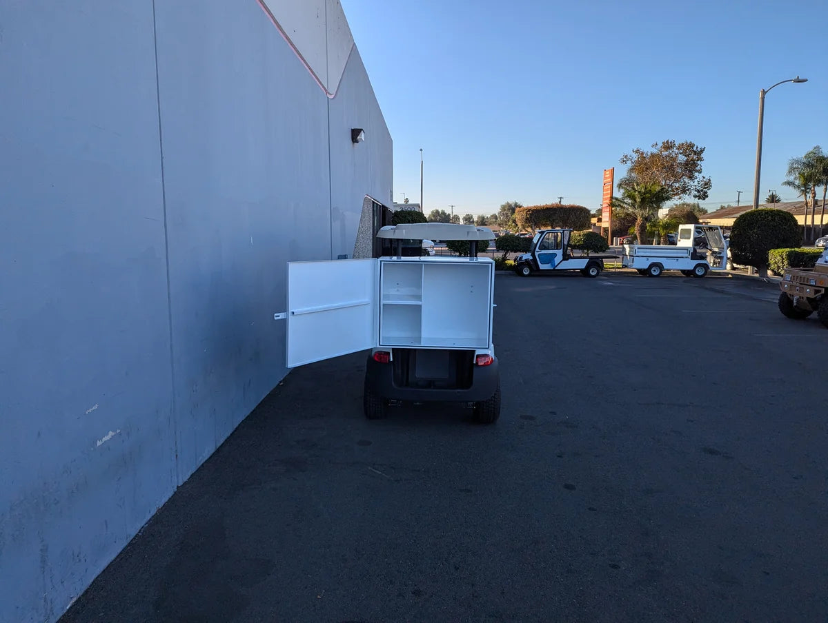 TB-36X18X28-FH BED MOUNT TOOLBOX WITH HINGED DOOR installed on a golf cart, shown open to reveal interior compartments, custom fabrication for golf carts.