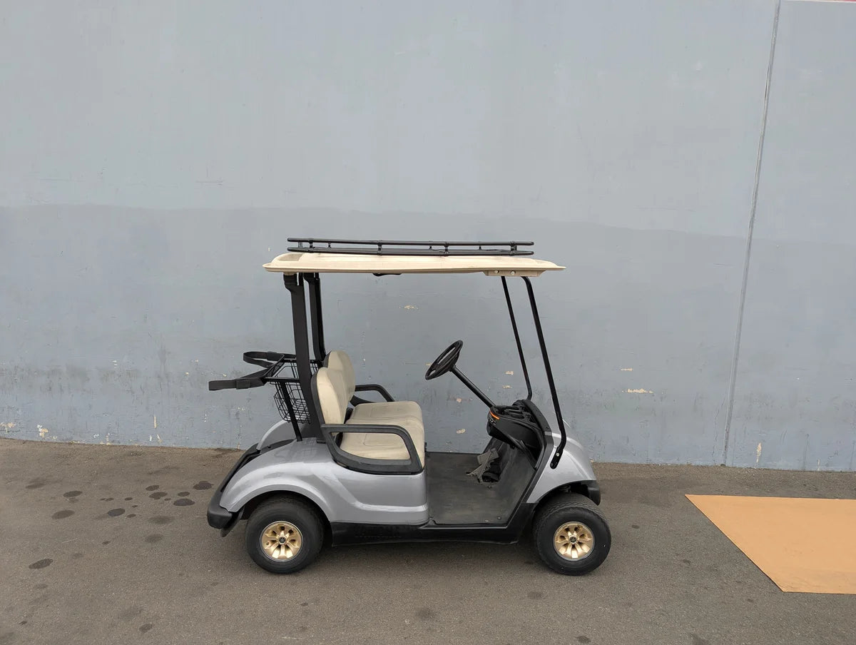 A silver golf cart equipped with the MRR-43X54-RR3 Heavy-Duty Golf Cart Roof Rack will fit most golf carts, showcasing custom fabrication designed for added cargo and utility.