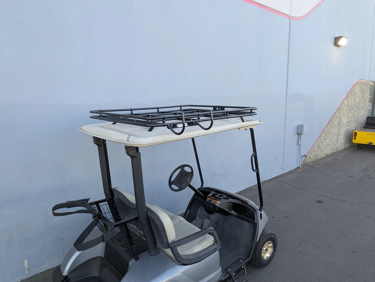 Golf cart fitted with CH-9MOUNT CHAIR HOOK FOR GOLF CART RACKS on the back, custom fabrication designed for securely holding cargo or accessories on golf cart racks.