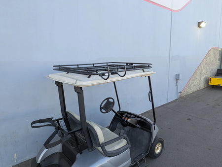 Golf cart fitted with CH-9MOUNT CHAIR HOOK FOR GOLF CART RACKS on the back, custom fabrication designed for securely holding cargo or accessories on golf cart racks.