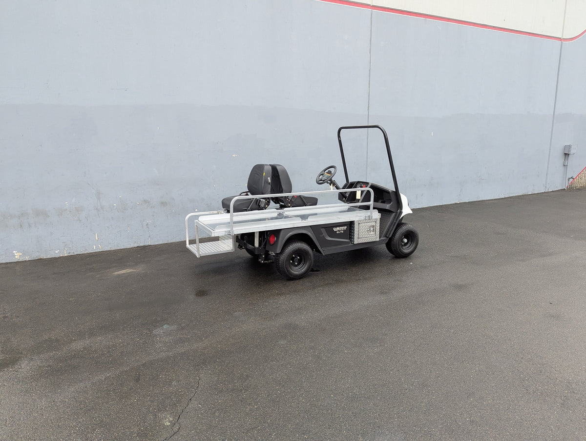 CUSH-EMT-84X24 EMT GOLF CART BED CONVERSION FOR CUSHMAN GOLF CART shown as a custom fabrication flatbed with metal railings on a Cushman golf cart for cargo and utility use.