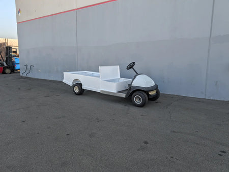 CC-PREC-ST-FLAT-72 CLUB CAR PRECEDENT 6 FOOT FLATBED CONVERSION showing custom fabrication for golf carts with a white flatbed utility surface attached to a golf cart base.
