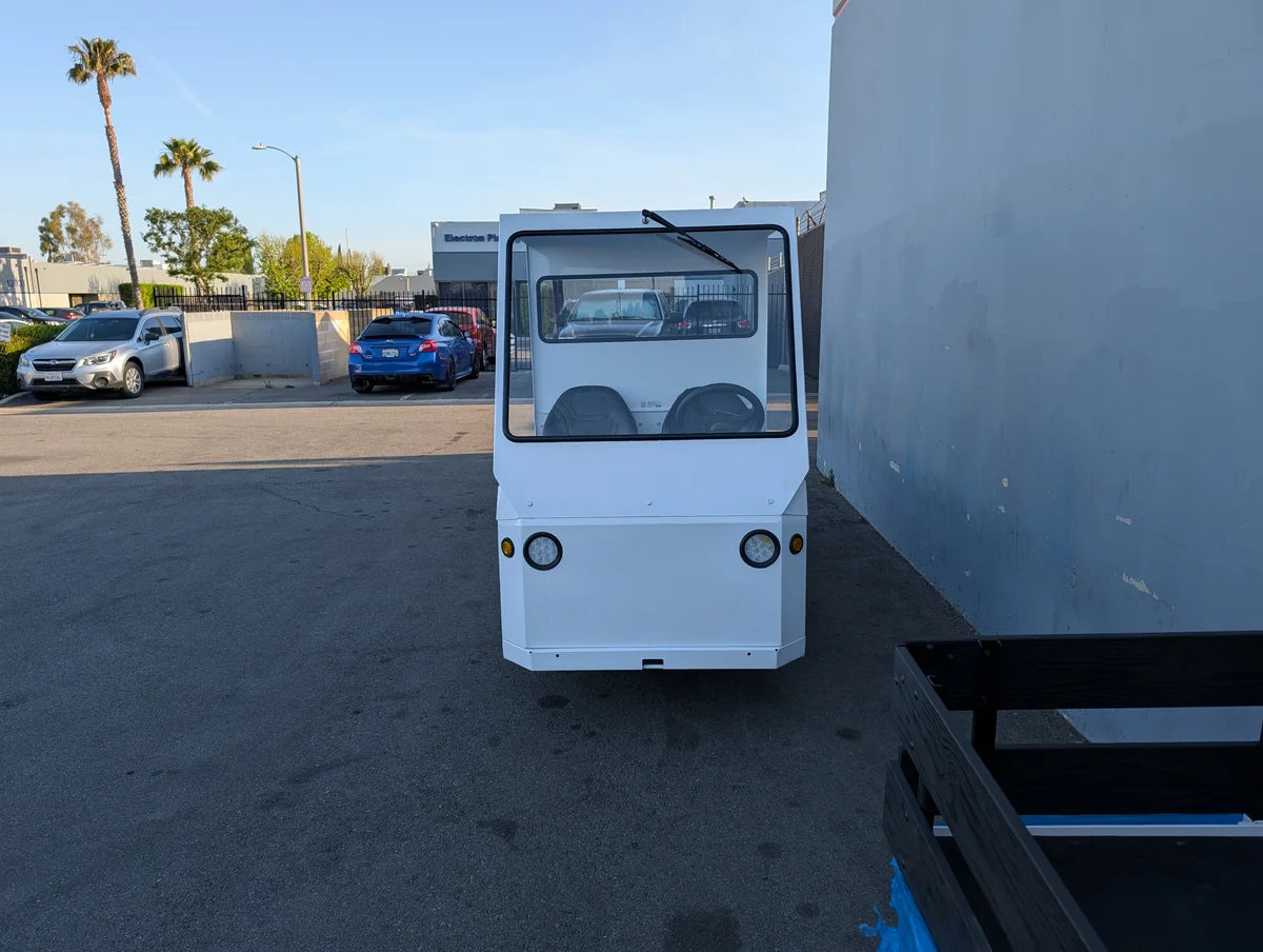 White custom fabrication cab enclosure installed on a utility golf cart, viewed from the front, SCE-TDBIG-CAB-ND CAB ENCLOSURE FOR TAYLOR DUNN BIGFOOT, NO DOORS.
