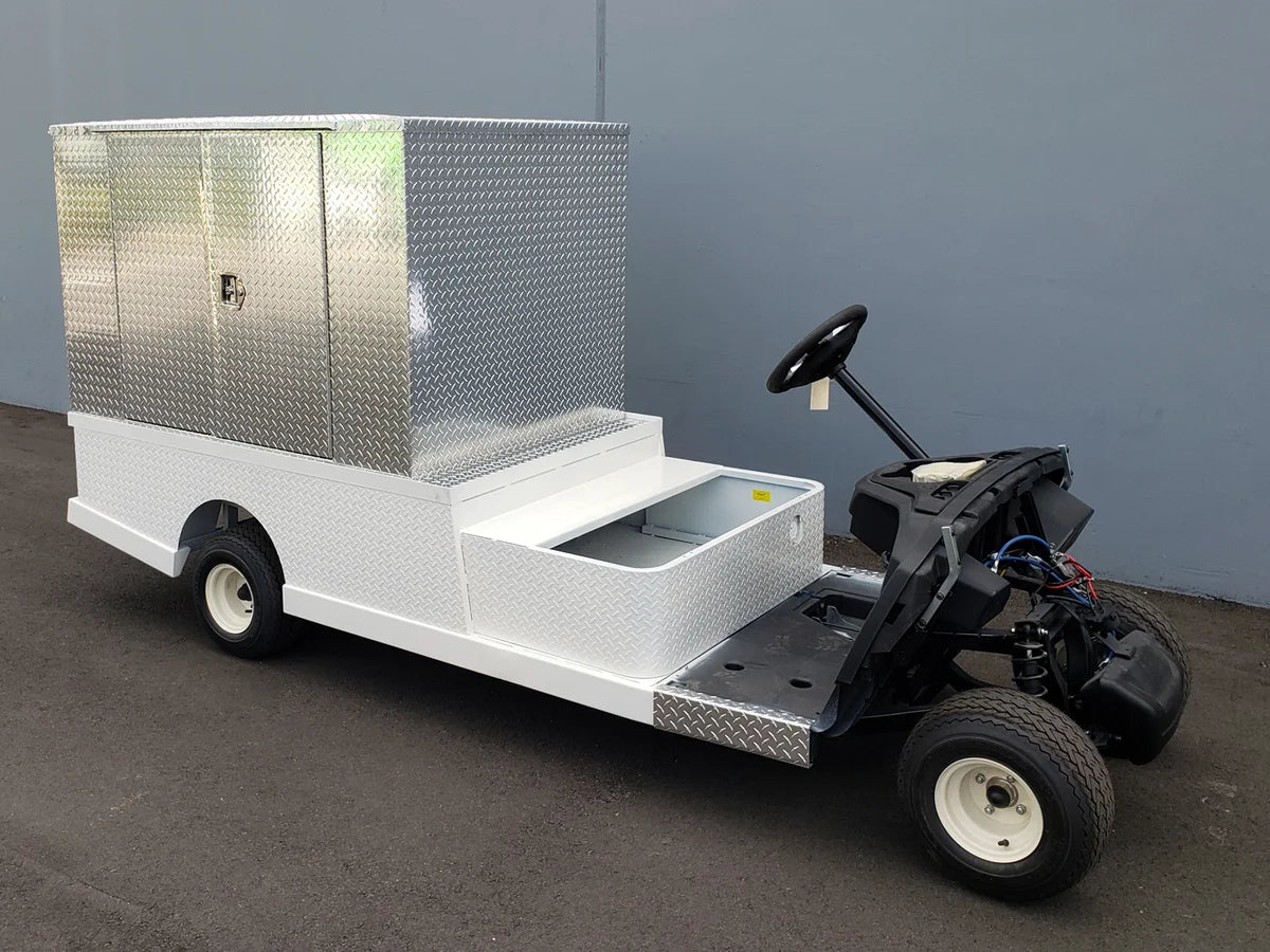 FMB-44X72X48-D-D3W3 FLATBED ALUMINUM DIAMOND PLATE MULTI-PURPOSE BOX 44″ WIDE X 72″ LONG X 48″ TALL WITH LOCKING DOORS ON REAR, LEFT AND RIGHT SIDE mounted on a custom fabricated golf cart for cargo and utility transport.