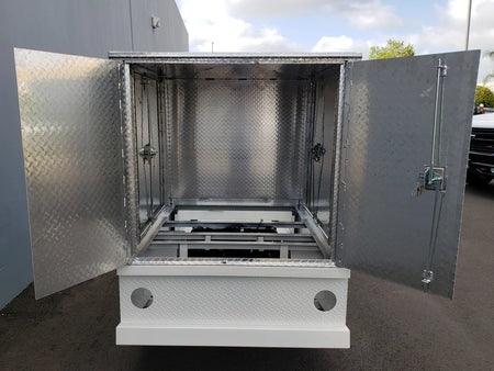 Open rear view of the FMB-44X72X48-D-D3W3 FLATBED ALUMINUM DIAMOND PLATE MULTI-PURPOSE BOX 44″ WIDE X 72″ LONG X 48″ TALL WITH LOCKING DOORS ON REAR, LEFT AND RIGHT SIDE showing custom fabrication for golf carts.